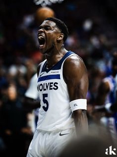 a basketball player yells during a game