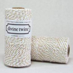 two spools of twine are sitting next to each other