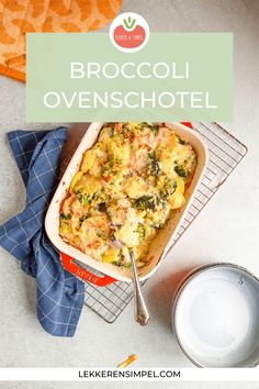 broccoli and cheese casserole in a baking dish with a blue napkin next to it