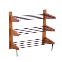 a wooden shelf with three shelves and two black metal bars on each side, against a white background