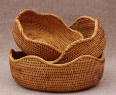 three woven baskets sitting on top of each other in front of a sign that says large 11 wide x 4 high