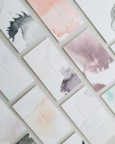 several watercolor cards with different colors on them