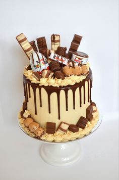 there is a cake that has chocolate and candy on it