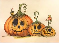 three pumpkins with faces painted on them