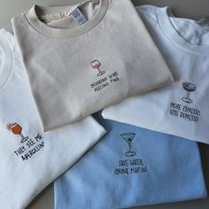 How gorgeous are these T-shirts 😭🍹 Just added them to my website! You’ll find them under core collection or search cocktail 🍸 Perfect for Summer (if we ever get one 🤣 ☀️) #embroidery #smallbusiness Crewneck Design Ideas, Diy Shirt Printing, Embroidery Men, Embroidery Clothes, Slogan Sweatshirt, Crewneck Design, Embroidered Tee