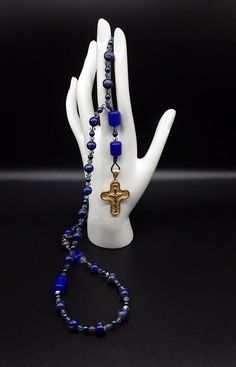 Spiritual Crucifix Necklace For Memorial, Handmade Cross Jewelry For Meditation, Blue Crucifix Necklace For Spiritual Wear, Blue Crucifix Necklace For Spiritual Purposes, Blue Jewelry With 8mm Beads As Gift, Blue Cross Spiritual Necklace, Blue 8mm Beads Jewelry For Gift, Sapphire Jewelry With Polished Beads For Gifts, Sapphire Jewelry With 8mm Beads As Gift