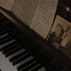 an old piano with writing on it