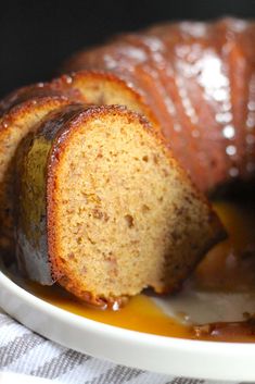 a bundt cake on a plate with caramel sauce