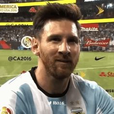 a man standing in front of a soccer field