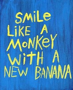 the words smile like a monkey with a new banana are painted on a blue background