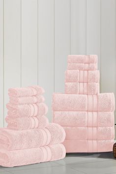 a stack of pink towels sitting next to each other