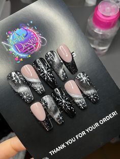 Celebrate the holiday season in style with our Black Cat Eye Press-On Nails, featuring an elegant silver cat-eye effect and shimmering snowflake accents! Perfect for adding a touch of festive glamour, this Christmas nail set is a beautiful blend of sophistication and holiday cheer. The rich, black base adds depth, while the silver cat-eye detail creates a mesmerizing, glimmering effect that catches the light with every movement. The delicate silver snowflakes complete the design, adding a touch of winter magic. Details: Color: Black base with silver cat-eye effect and silver snowflake accents Features: Durable, reusable, and easy to apply for a salon-quality look at home Made with high-quality materials for a comfortable and long-lasting fit Perfect for holiday parties, gifts, or a unique Black And Silver Winter Nails, Black Silver Christmas Nails, Cat Eye Winter Nails, Black And Silver Christmas Nails, Cat Eye Nails Christmas, Holiday Nails Black, Black Xmas Nails, Cat Eye Christmas Nails, Silver And Black Nails