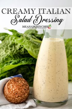 creamy italian salad dressing with spinach leaves in the background