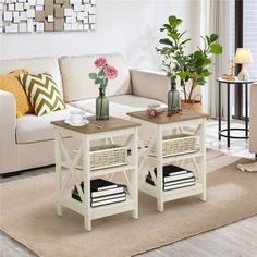 two coffee tables sitting on top of a rug in front of a couch and table