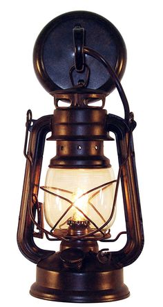 an old fashioned lantern with a light on top