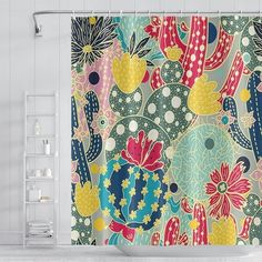 a colorful shower curtain with cactus and flowers on the outside, hanging in a bathroom