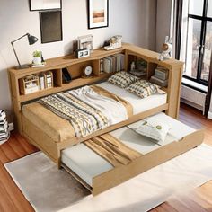 a bed that is sitting in the middle of a room with a book shelf above it