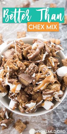 a white bowl filled with chocolate and marshmallows on top of a table