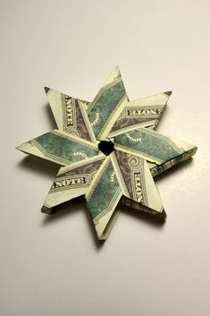 an origami star made out of one dollar bill