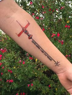 a person's arm with a tattoo on it that has an airplane and the words,