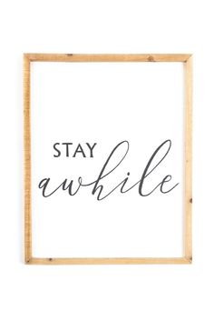 a black and white print with the words stay awhile in cursive writing on it