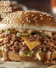 a big mac sloppy joes cheeseburger sitting on top of a table