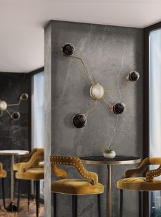 an elegant dining room with yellow velvet chairs