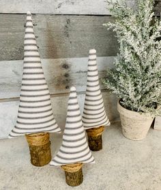 three small christmas trees sitting next to each other