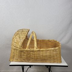 a wicker basket sitting on top of a table