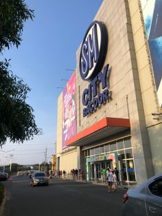 people walking in front of a city block store