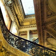 an ornate stair case in the middle of a building