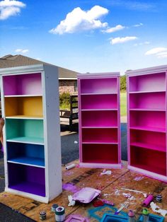 two bookshelves are being painted in different colors