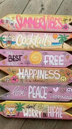 four wooden signs with different sayings on them