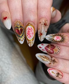 the manies are decorated with different designs and colors, including hearts on each nail