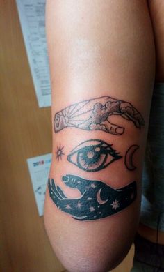 a woman's leg with an all seeing and eye tattoo on it