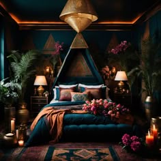 a bed with blue sheets and pillows in a room filled with plants, candles and flowers