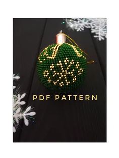 a green beaded ornament with white snowflakes in the background and text that reads pdf pattern