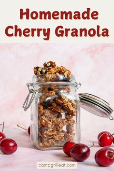 homemade cherry granola in a glass jar with cherries around it and text overlay