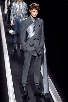 At the menswear shows in London, Florence, Milan, and Paris, the season was all about a new mood—and some new innovations in pants. Futuristic Fashion For Men, Futuristic Fashion Menswear, Mens Haute Couture Menswear, Futuristic Mens Fashion Cyberpunk, Mens Red Carpet Fashion, Futuristic Suits Men, Cyberpunk Suit And Tie, Futuristic Casual Fashion, Dior Men Suit