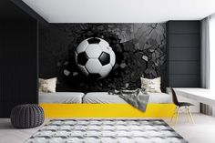 a bedroom with a soccer ball on the wall