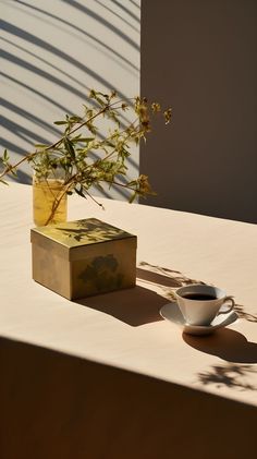 A cup of tea on a table adorned with luxury cloth accessories, under the warm sunlight. Golden Morning, Morning Tea