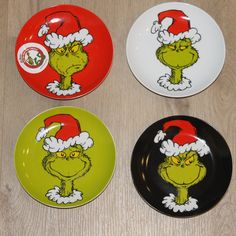 three plates with the grin's face painted on them