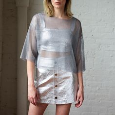 Silver Trace Mini Skirt | Mirimalist | Wolf & Badger Spring Sheer Mini Skirt, Metallic Summer Skirt, Metallic Skirt For Summer, Sheer Mini Skirt For Summer, Chic Sheer Mini Skirt, Metallic Mini Skirt For Summer, Metallic Lined Skirt For Summer, Modern Mini Bottoms For Summer, Modern Mini Skirt For Summer