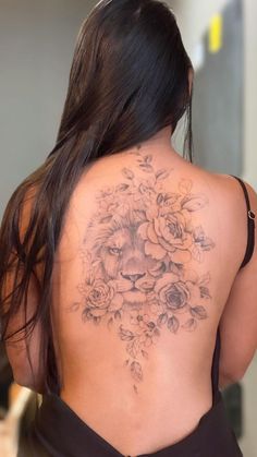 a woman with a tattoo on her back