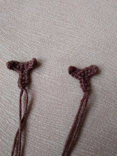 two pieces of crocheted fabric with tassels