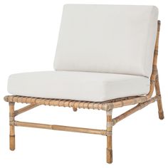 a white cushioned chair with wooden legs