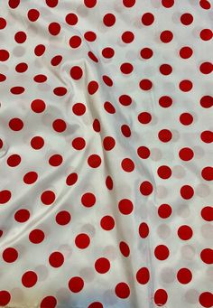 a red and white polka dot print fabric