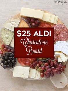 a platter with cheese, grapes and meats on it for $ 25 aldi