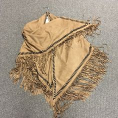 Swede like western fringe shawl in two colors brown and grey one size. Fringe Shawl Outerwear For Fall, Fall Festival Poncho With Tassels, Fringe Shawl Cape For Fall, Beige Cape Shawl For Fall, Fall Shawl Cape With Fringe, Bohemian Cape With Tassels For Fall, Bohemian Tassel Cape For Fall, One Size Poncho With Tassels In Cape Shape, Brown Fringed Poncho For Fall