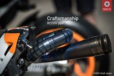 an orange and black motorcycle with the words craftsmanship on it